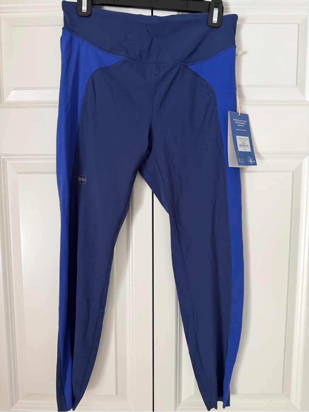Janji Navy and White Running Apparel Tag